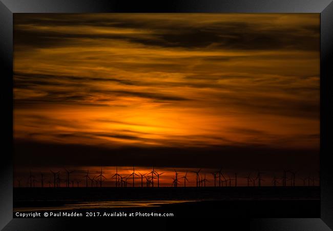 Sunset over the wind farm Framed Print by Paul Madden