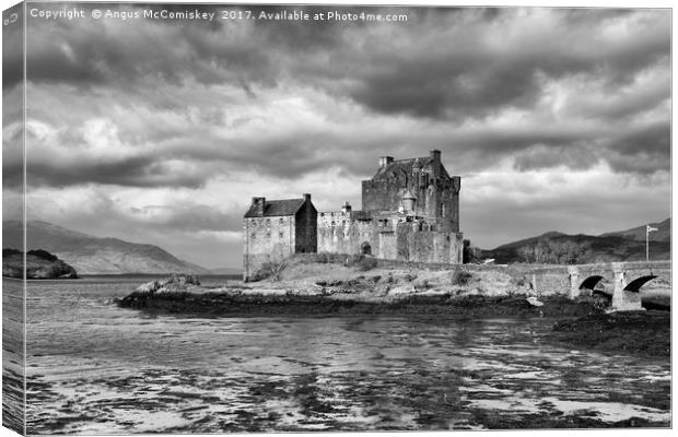 Dramatic sky over Eilean Donan Castle Canvas Print by Angus McComiskey