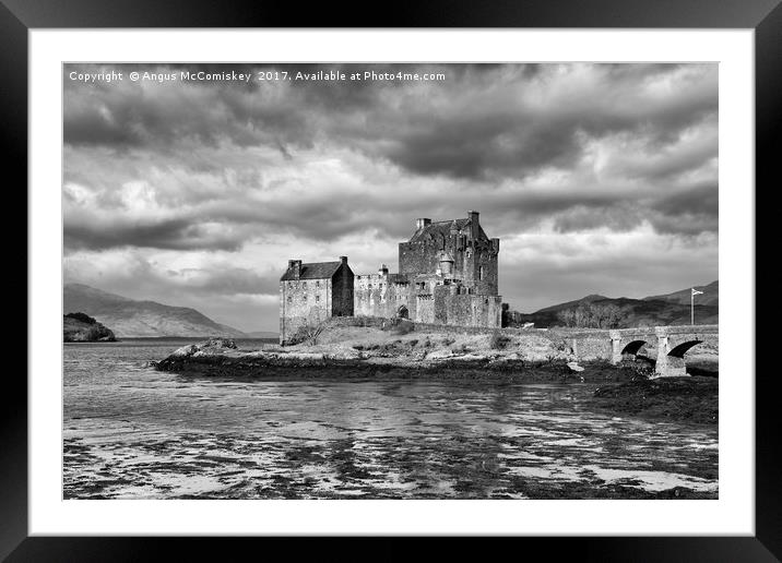 Dramatic sky over Eilean Donan Castle Framed Mounted Print by Angus McComiskey