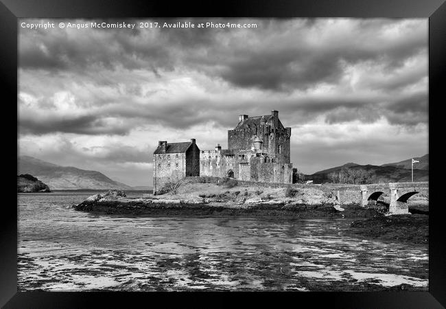 Dramatic sky over Eilean Donan Castle Framed Print by Angus McComiskey