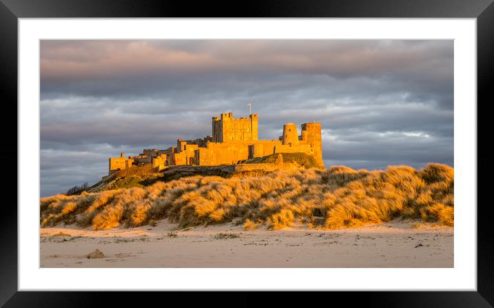 Sun setting on Iconic Bamburgh Castle Framed Mounted Print by Naylor's Photography