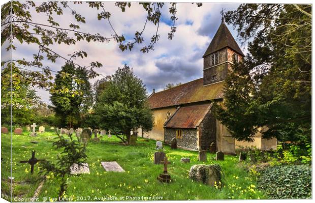 The Churchyard at St Laurence Tidmarsh Canvas Print by Ian Lewis