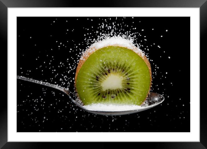 Kiwi fruit cut in half on a spoon with sugar Framed Mounted Print by Simon Bratt LRPS
