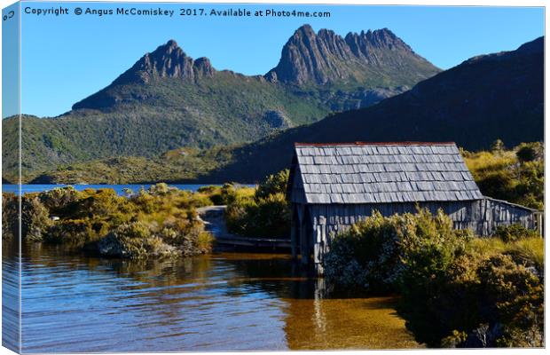 Boat shed with backdrop of Cradle Mountain Canvas Print by Angus McComiskey