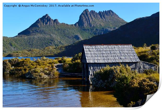 Boat shed with backdrop of Cradle Mountain Print by Angus McComiskey