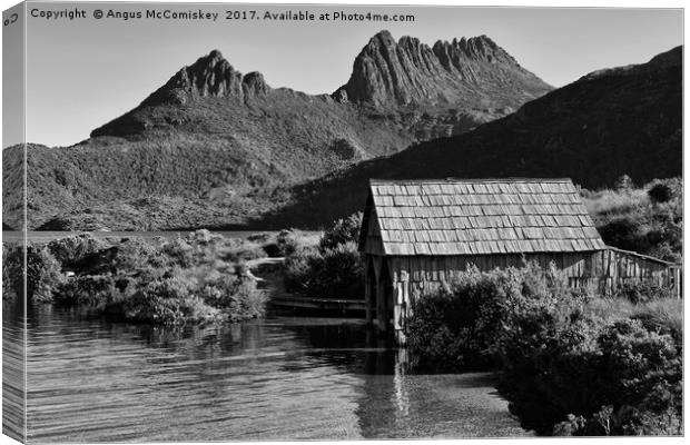 Boat shed with backdrop of Cradle Mountain (mono) Canvas Print by Angus McComiskey