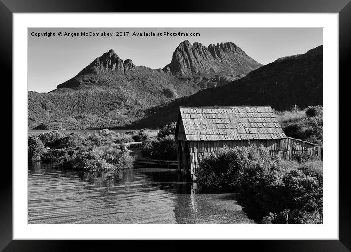 Boat shed with backdrop of Cradle Mountain (mono) Framed Mounted Print by Angus McComiskey