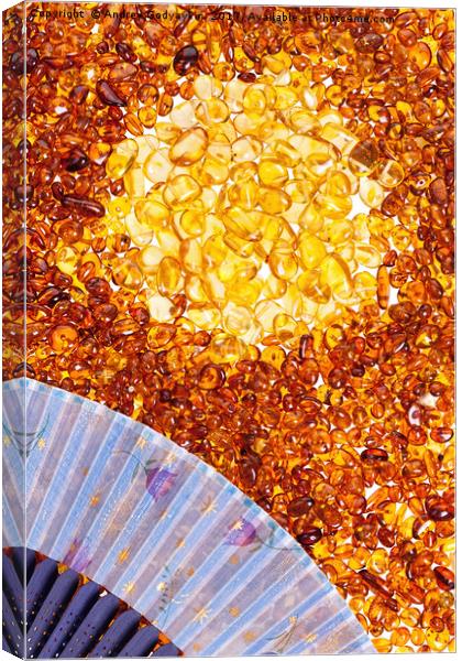 Stones of yellow amber and a blue fan. Canvas Print by Andrey  Godyaykin