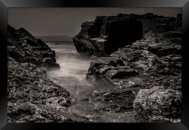 Rocky sea Inlet Framed Print by Eddie John