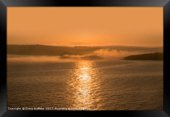 Misty Sunrise over Newquay Framed Print by Diane Griffiths