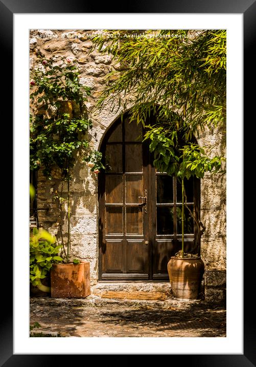 A Shadowy Door in Saint Paul de Vence, France. Framed Mounted Print by Maggie McCall