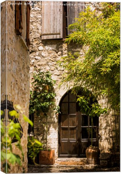 A Shadowy Door and Alley in Saint Paul de Vence Fr Canvas Print by Maggie McCall