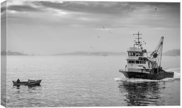 A fishing trawler sales on the river Bosphorus in  Canvas Print by George Cairns