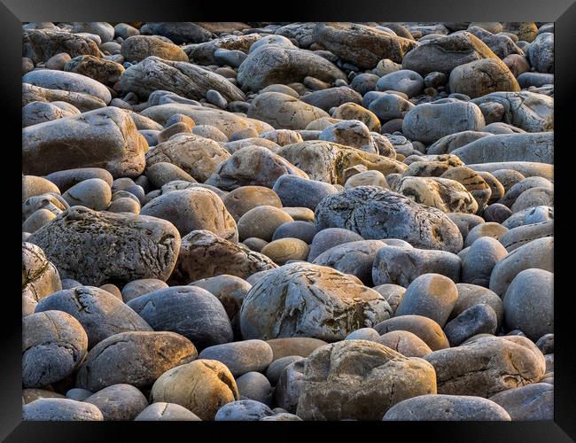 Sunset Glow on Pebbles Framed Print by Colin Allen