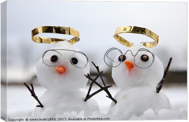 Two cute snowman angles with golden halos Canvas Print by Simon Bratt LRPS