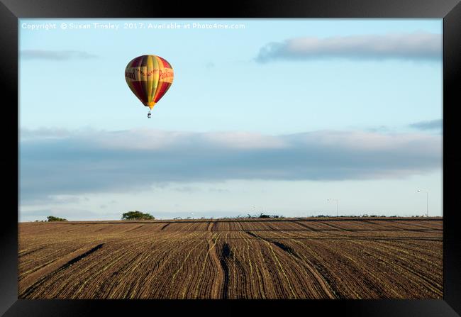 Ballooning over farmland Framed Print by Susan Tinsley