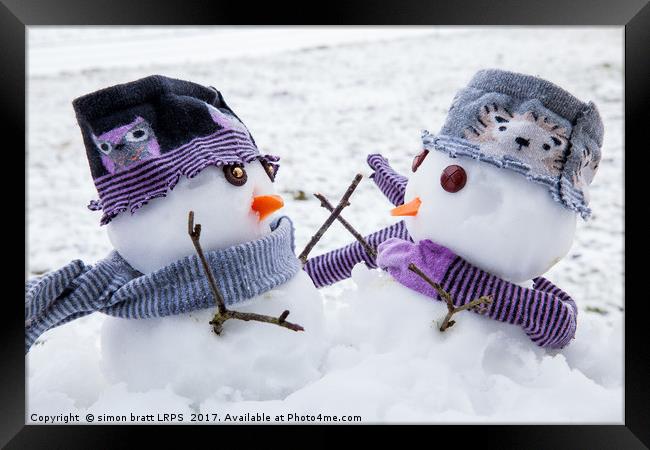 Two cute snowmen friends embracing Framed Print by Simon Bratt LRPS
