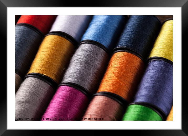 Colorful cotton reels viewed at an angle Framed Mounted Print by Simon Bratt LRPS