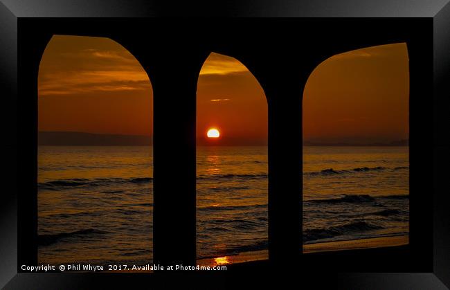 Sunset through the arches Framed Print by Phil Whyte