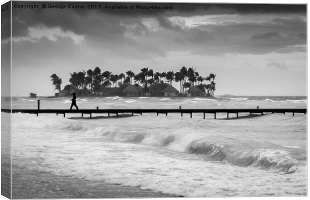 A man walks along a jetty on a stormy day Canvas Print by George Cairns