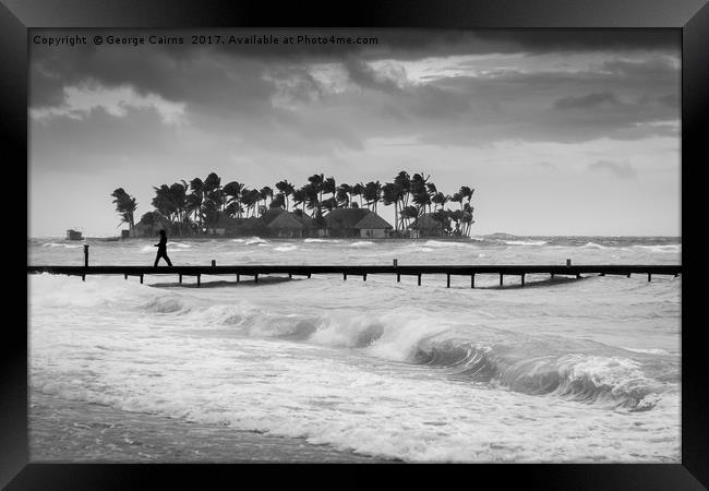 A man walks along a jetty on a stormy day Framed Print by George Cairns