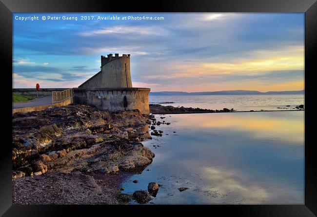Sunset on Saltcoats Sea defence.  Framed Print by Peter Gaeng