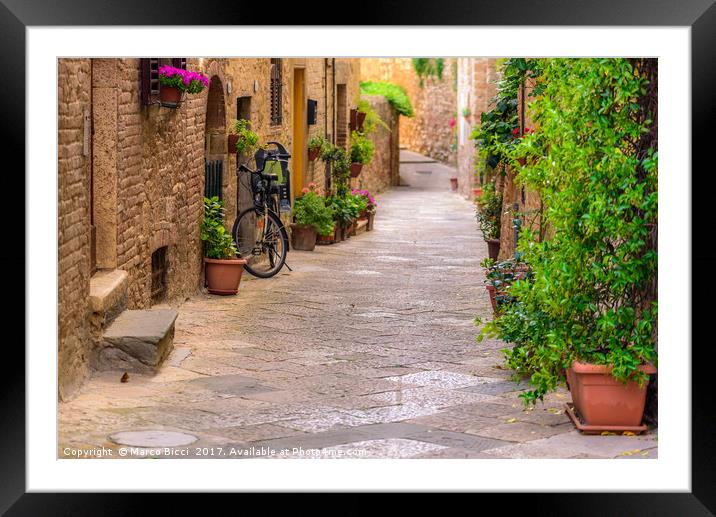Bicycle leaning against the wall Framed Mounted Print by Marco Bicci