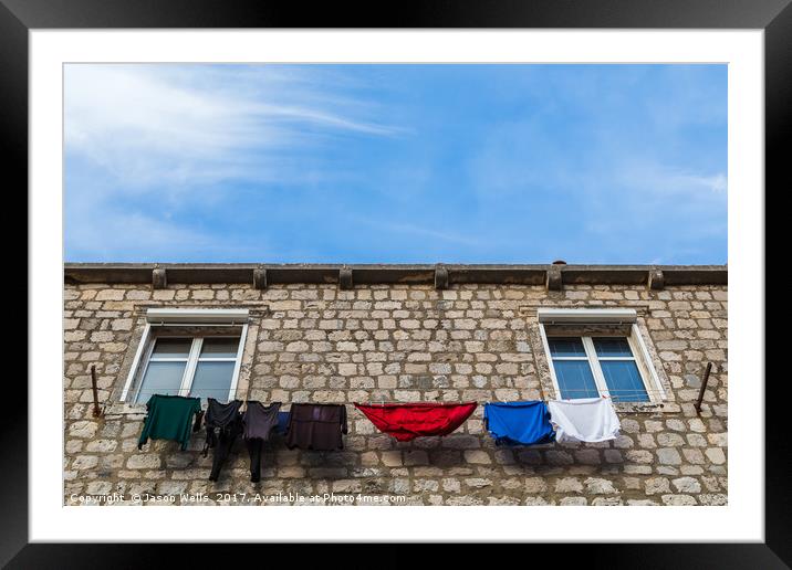 Looking up at laundry on the line Framed Mounted Print by Jason Wells