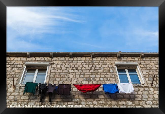 Looking up at laundry on the line Framed Print by Jason Wells