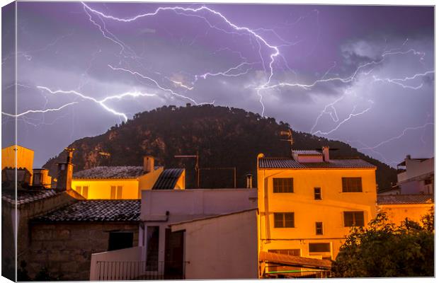 Lightning over the Puig Canvas Print by Perry Johnson
