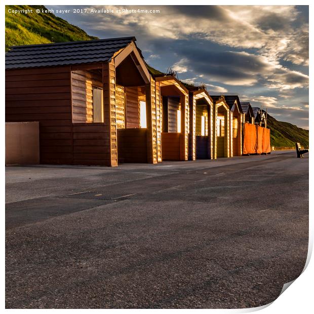 Saltburn beach huts at sunset Print by keith sayer