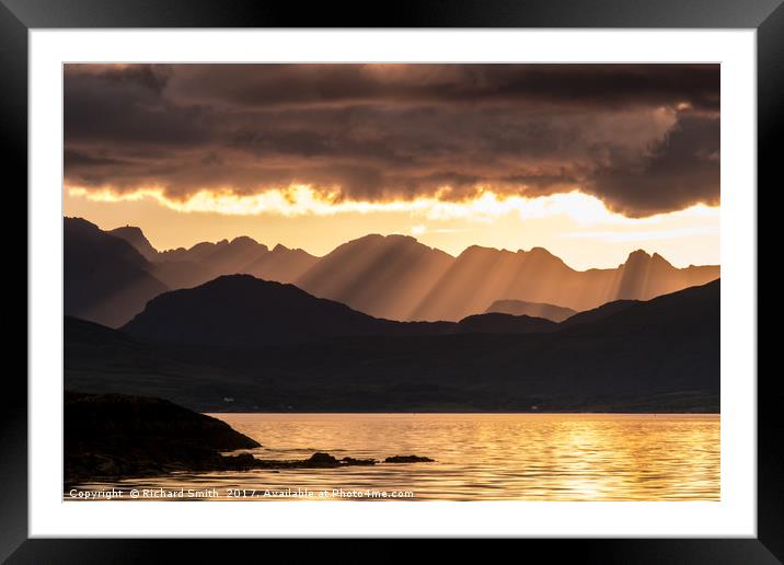 Evening crepuscular rays over the Cuillin Hills. Framed Mounted Print by Richard Smith