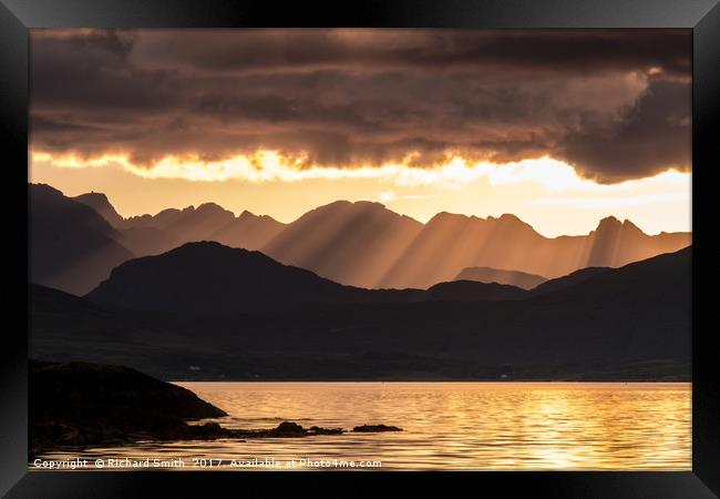 Evening crepuscular rays over the Cuillin Hills. Framed Print by Richard Smith