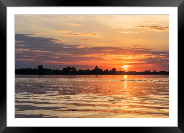 Sunset over river waters Framed Mounted Print by Dobrydnev Sergei