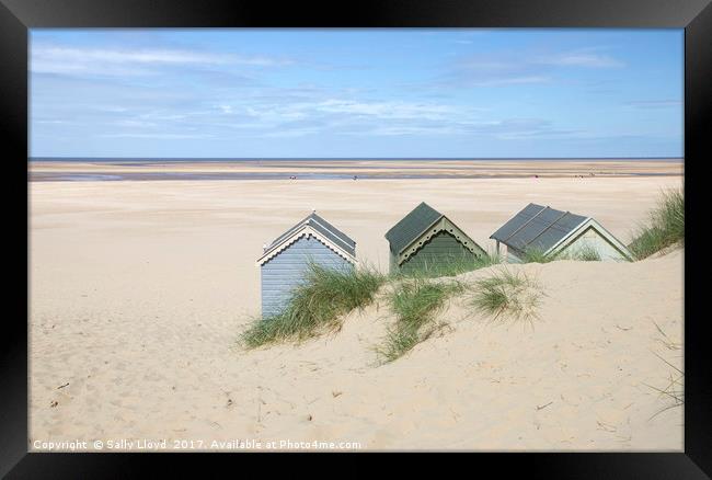 Beach Hut view Framed Print by Sally Lloyd