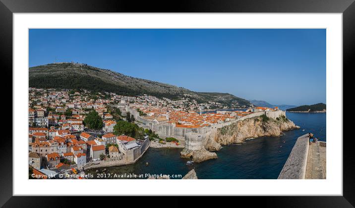 Tourists look out towards the old town of Dubrovni Framed Mounted Print by Jason Wells
