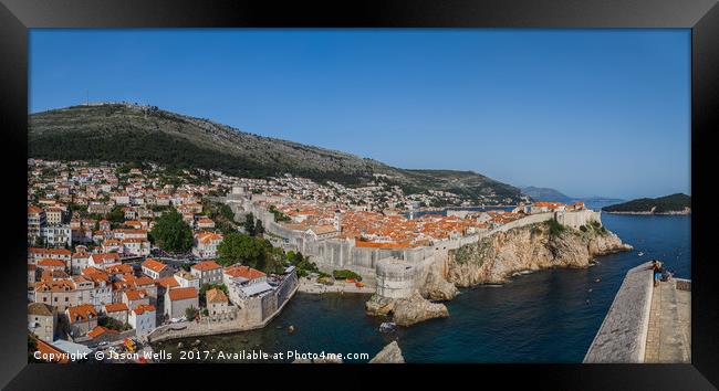Tourists look out towards the old town of Dubrovni Framed Print by Jason Wells