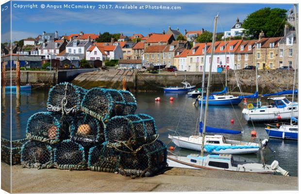 Lobster pots on quayside at St Monans Canvas Print by Angus McComiskey