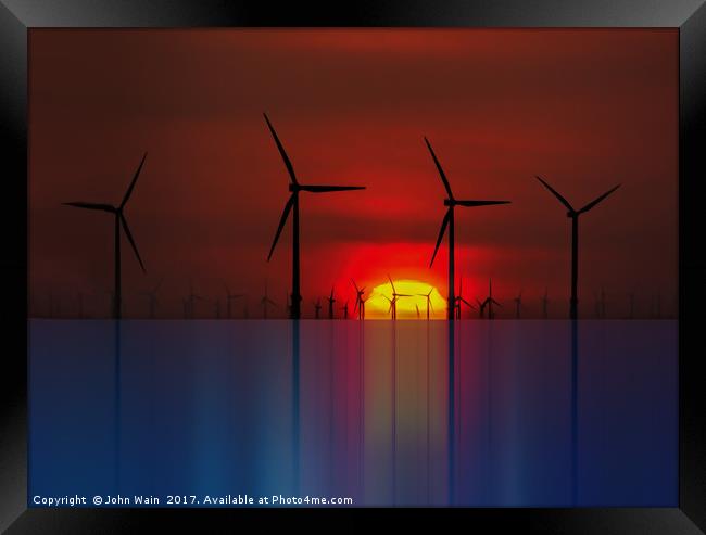 Windmills at the Horizon  Framed Print by John Wain