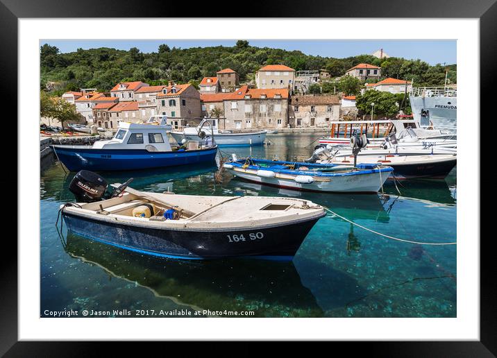 Boats moored off the promenade in Sipan Framed Mounted Print by Jason Wells