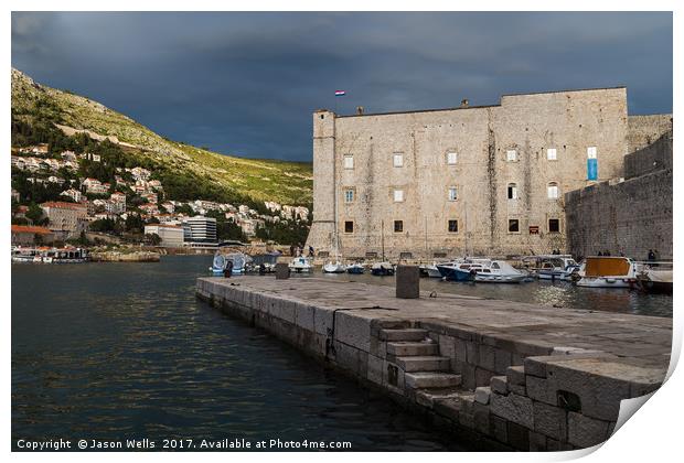 Stormy skies behind St John’s Fortress Print by Jason Wells