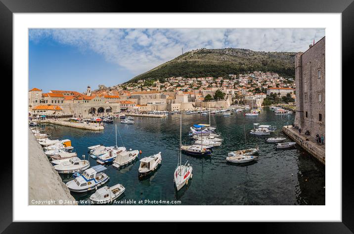 Fishing boats and yachts in the old harbour of Dub Framed Mounted Print by Jason Wells