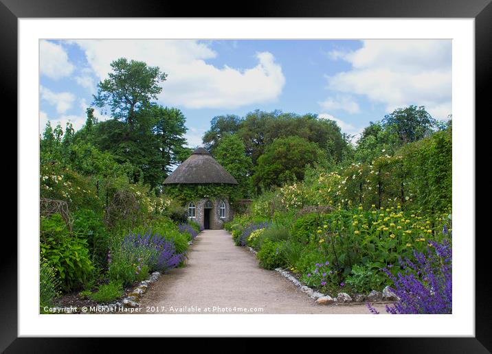 The thatched Round House in West Dean Gardens in W Framed Mounted Print by Michael Harper