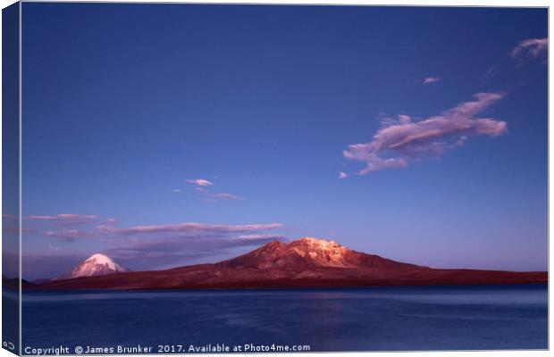 Twilight Over Lake Chungara and Volcanos Chile Canvas Print by James Brunker