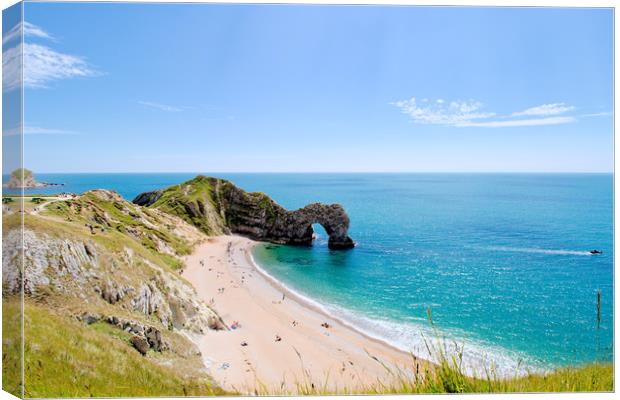 Durdle door and beach in the Summer sunshine. Canvas Print by Simon J Beer