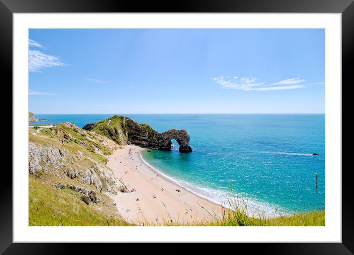 Durdle door and beach in the Summer sunshine. Framed Mounted Print by Simon J Beer