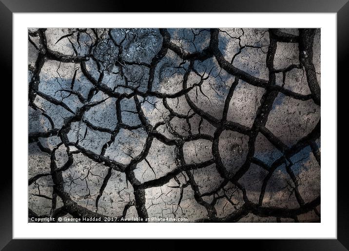 Crack in the sand. Framed Mounted Print by George Haddad