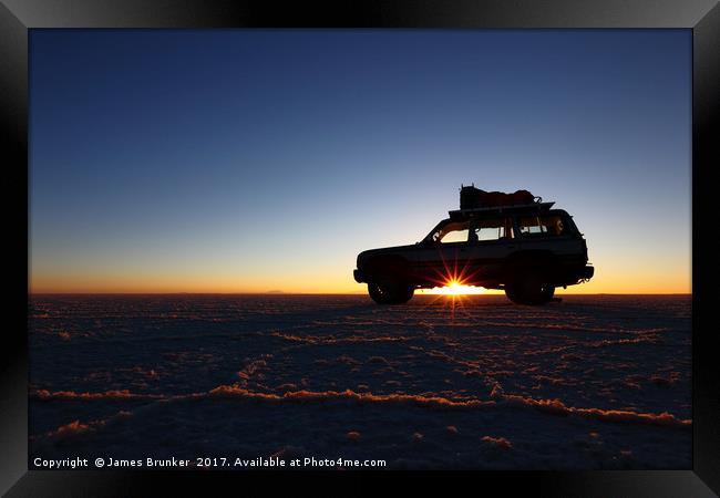 Driving Across the Salar de Uyuni at Dawn Bolivia Framed Print by James Brunker