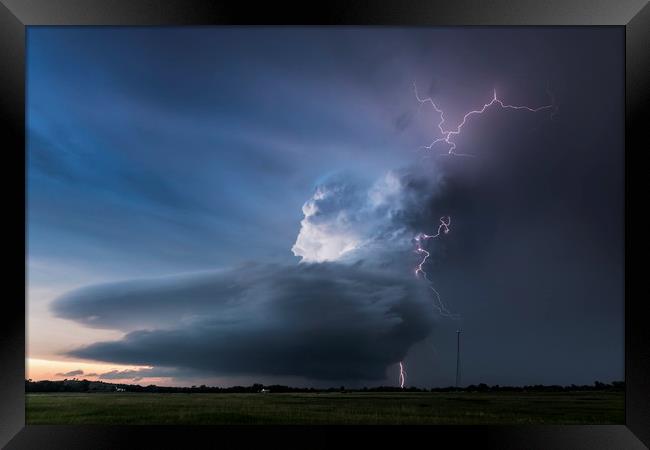 Broken Bow lightning, Nebraska.  Framed Print by John Finney