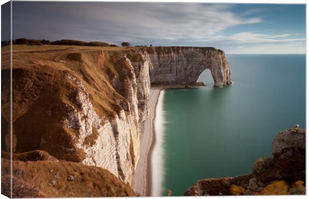 The cliffs and Manneporte arch at Etretat Canvas Print by Leighton Collins